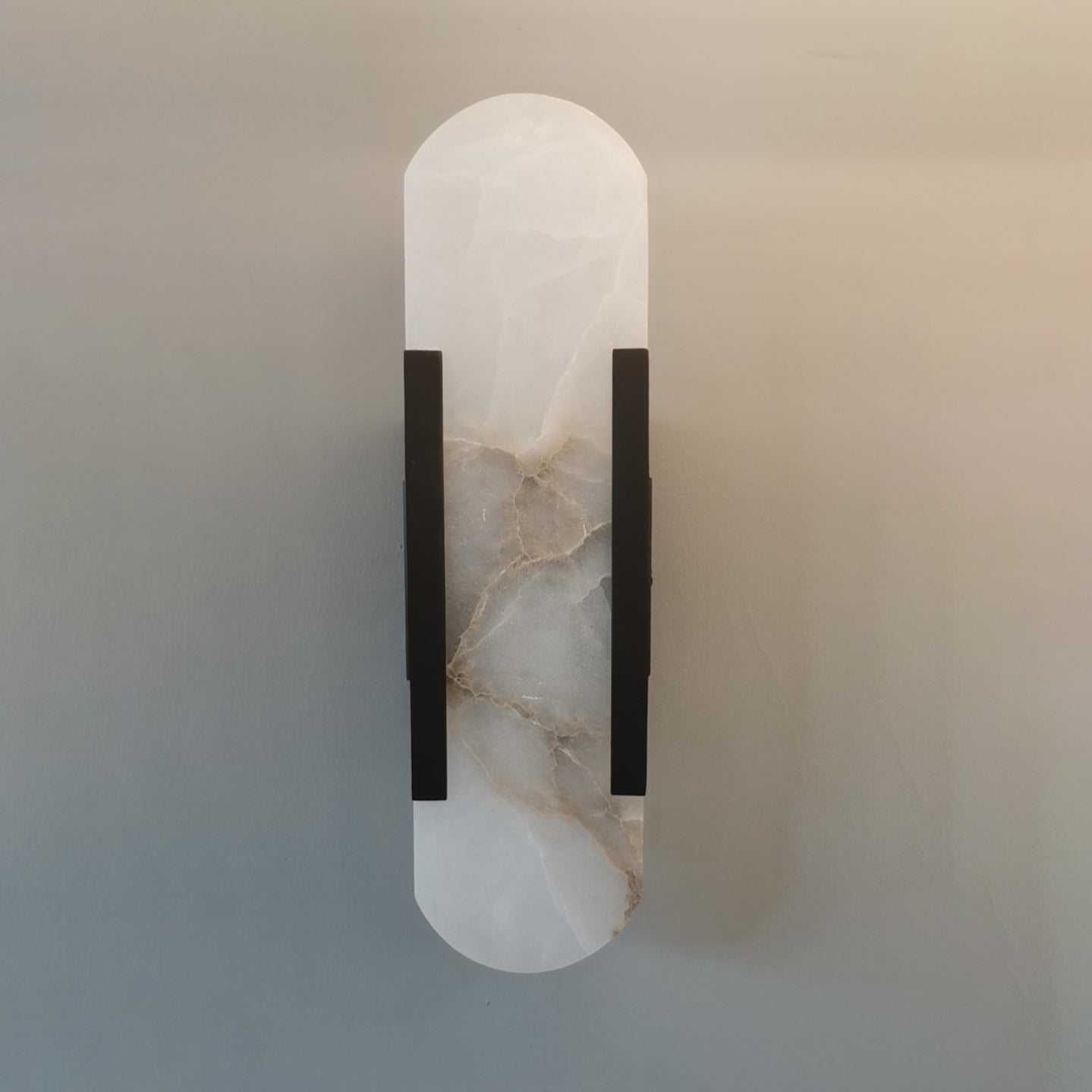 Moran - Applique da parete ovale in marmo con lampada LED regolabile